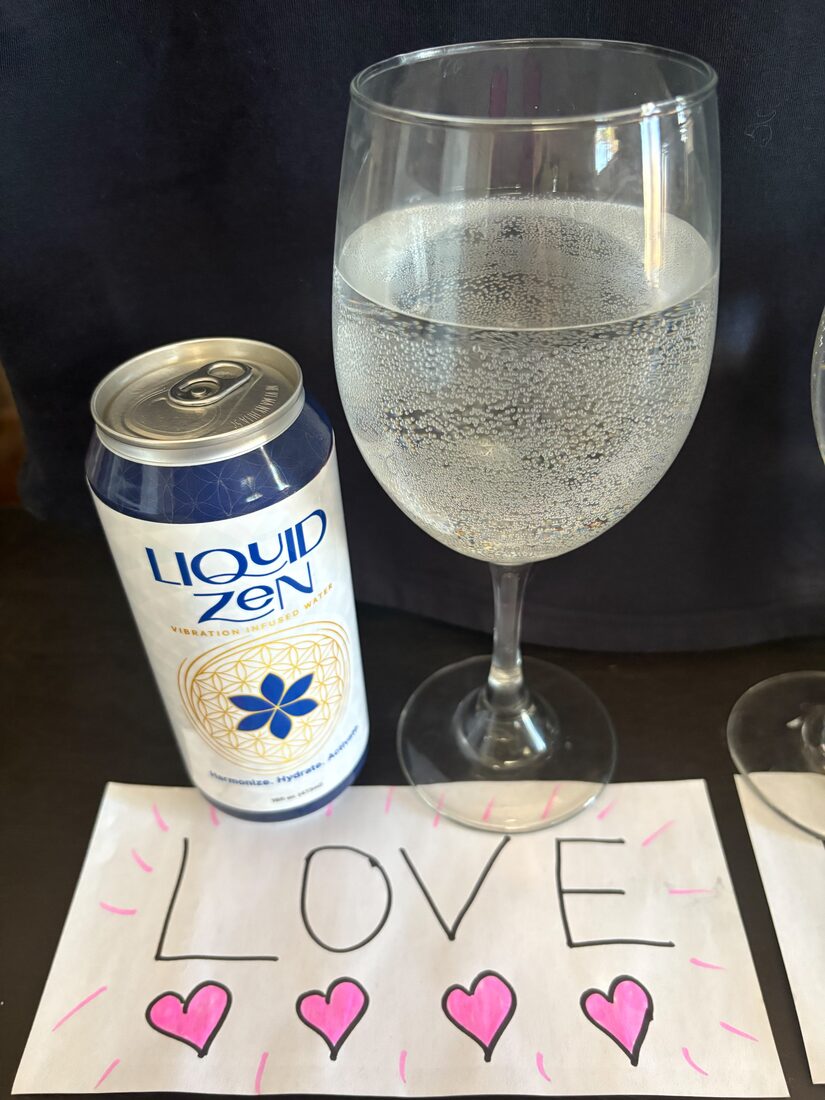 A Liquid Zen can beside a handwritten LOVE note