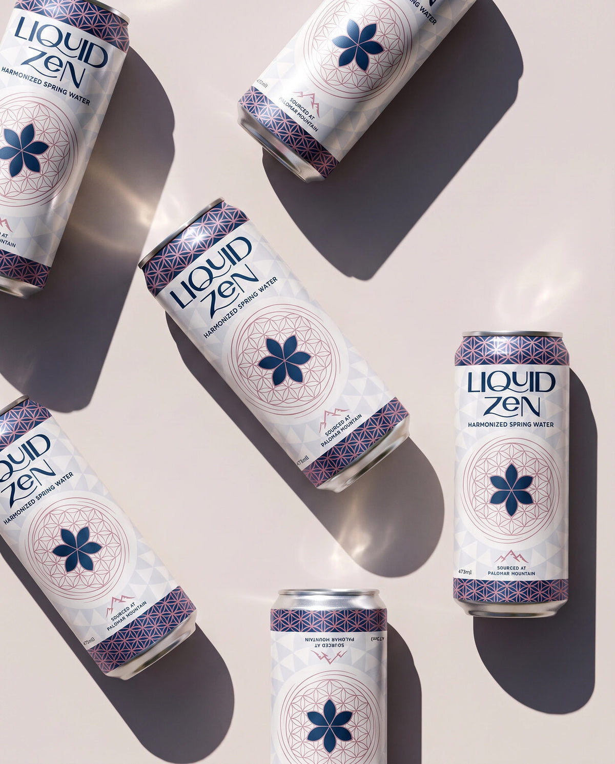 Liquid Zen cans arranged in natural sunlight